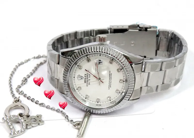 Rolex zenski sat i Dior narukvica