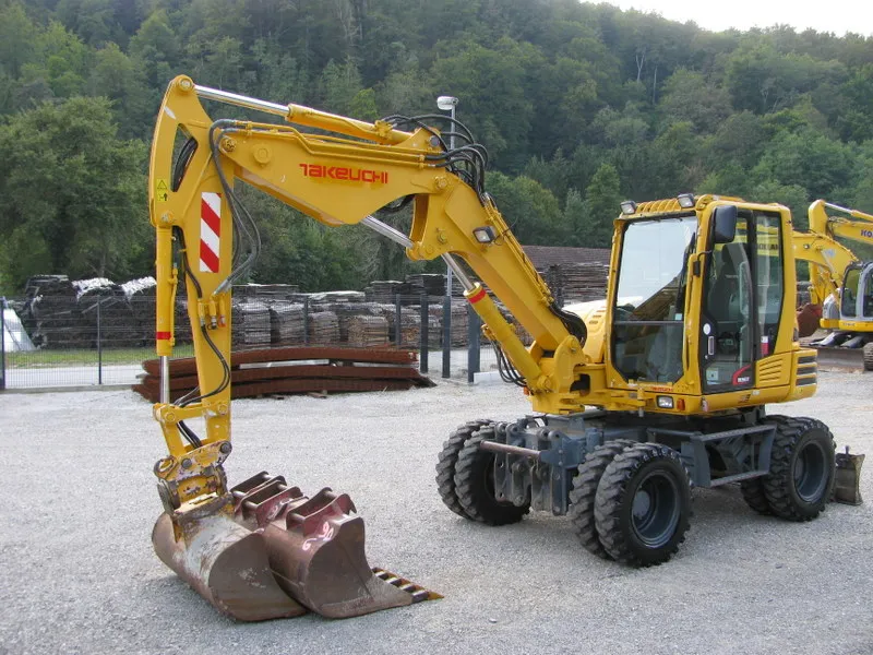 Bager točaš Takeutchi TB295W sa POWERTILLT 4 kašike