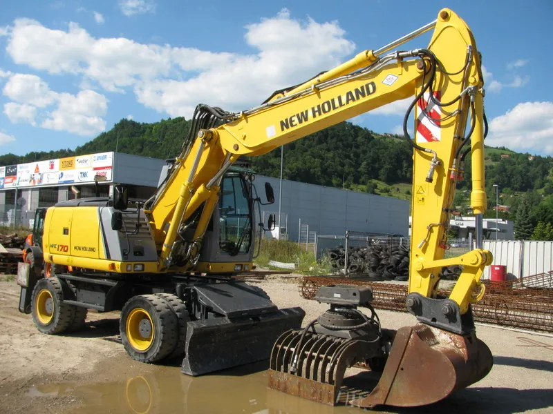 New Holland WE1170C pune gume  + grajfer+ klasične gume